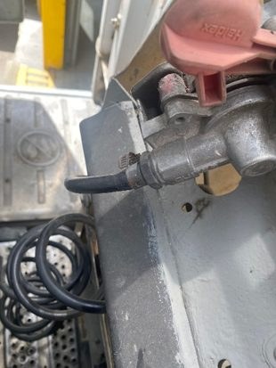 Red emergency gladhand coupling and air line at the connection point